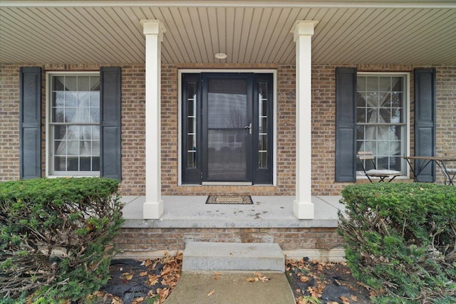 doorway to property featuring covered porch