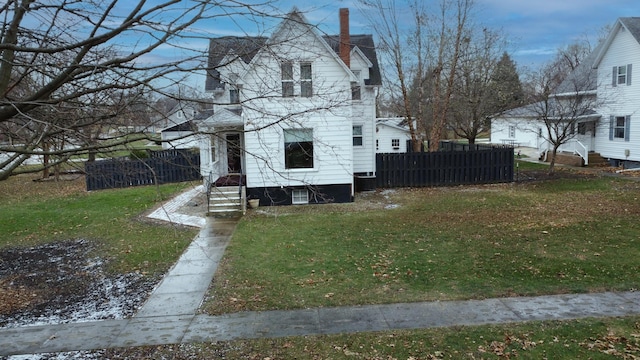 view of side of home featuring a yard