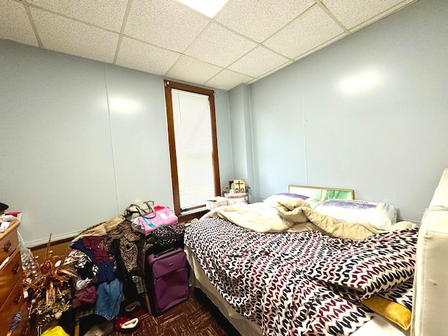 bedroom with a paneled ceiling