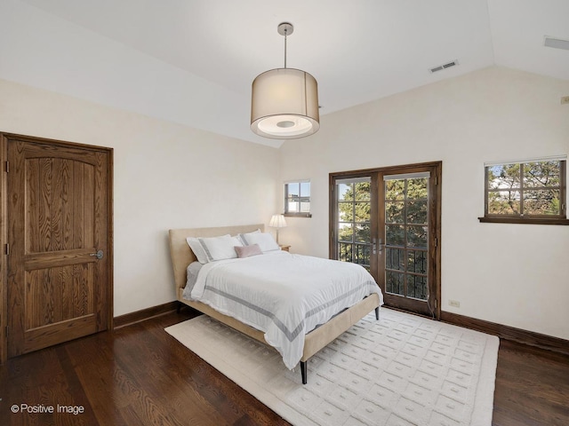 bedroom with french doors, access to exterior, lofted ceiling, and dark hardwood / wood-style flooring