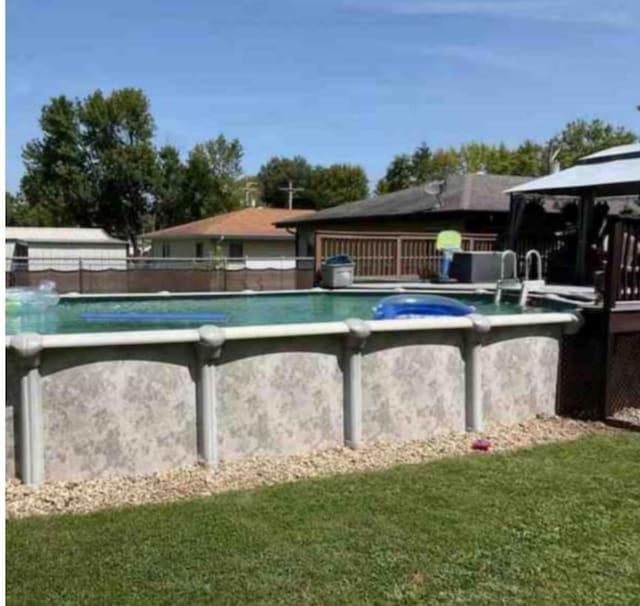 view of pool featuring a gazebo and a lawn