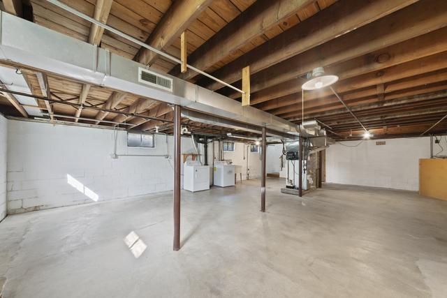 basement with washer and clothes dryer