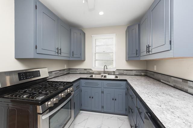 kitchen featuring stainless steel range with gas cooktop and sink