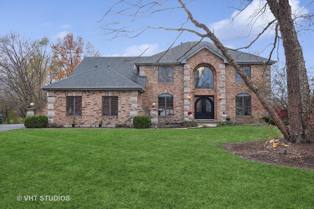 view of front facade featuring french doors and a front lawn