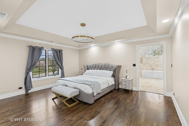 bedroom with dark hardwood / wood-style floors, a raised ceiling, multiple windows, and crown molding