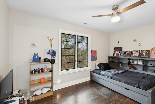 bedroom featuring dark hardwood / wood-style floors and ceiling fan