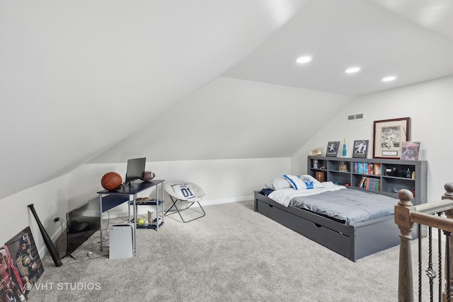 bedroom with light carpet and vaulted ceiling