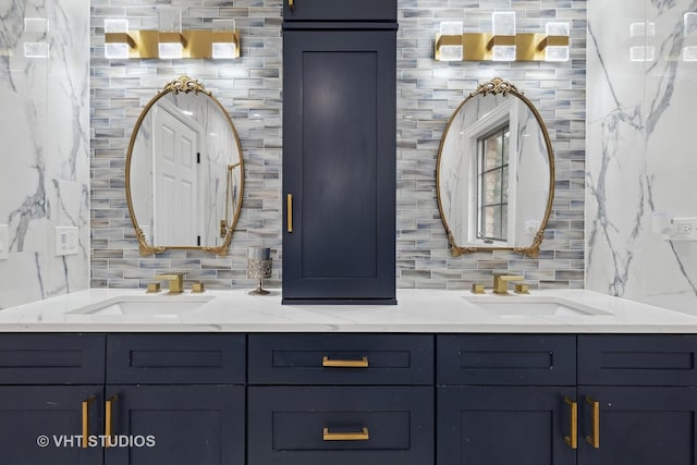 bathroom with vanity and tasteful backsplash