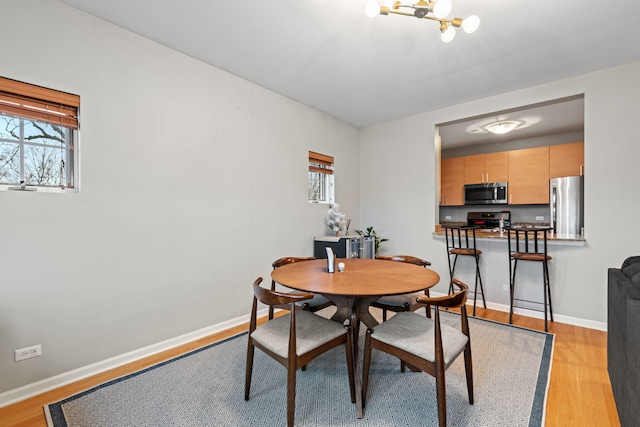 dining room featuring light hardwood / wood-style flooring