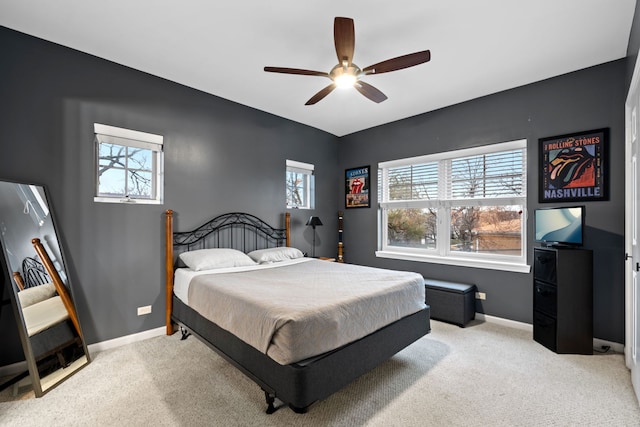 bedroom featuring ceiling fan and light carpet