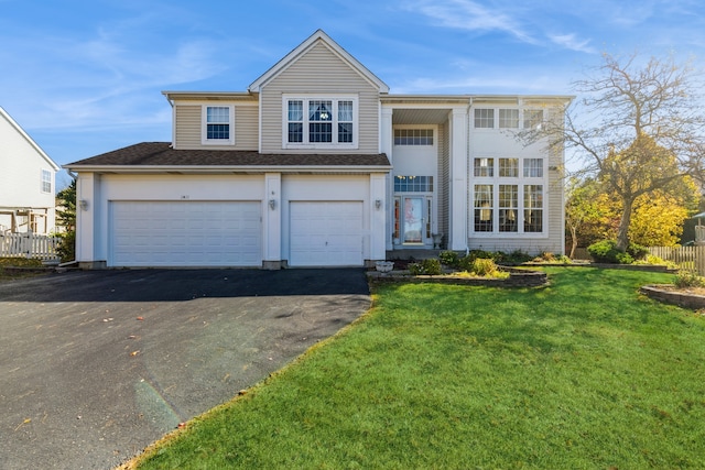 view of front facade with a front lawn and a garage