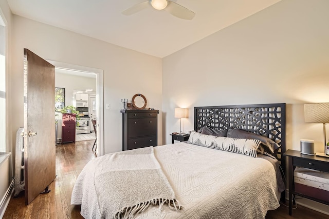 bedroom with ceiling fan and dark hardwood / wood-style flooring