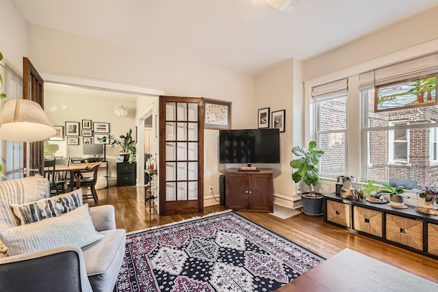 living room with hardwood / wood-style flooring and french doors