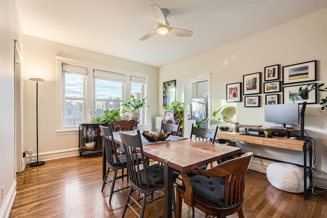 dining area featuring hardwood / wood-style floors and ceiling fan