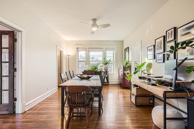 dining space with ceiling fan and dark hardwood / wood-style flooring