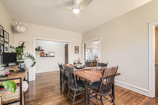 dining area with dark hardwood / wood-style flooring and ceiling fan