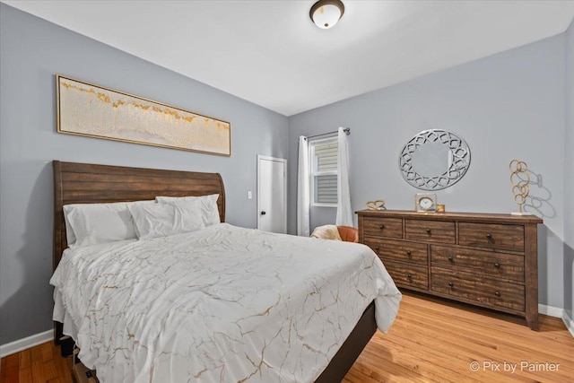 bedroom with hardwood / wood-style flooring