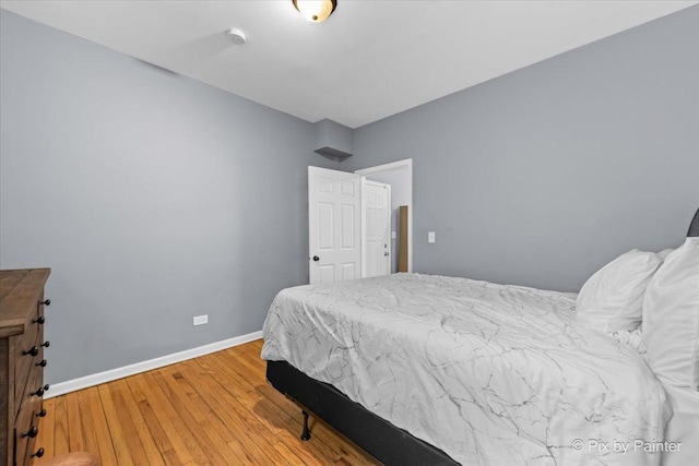 bedroom featuring wood-type flooring