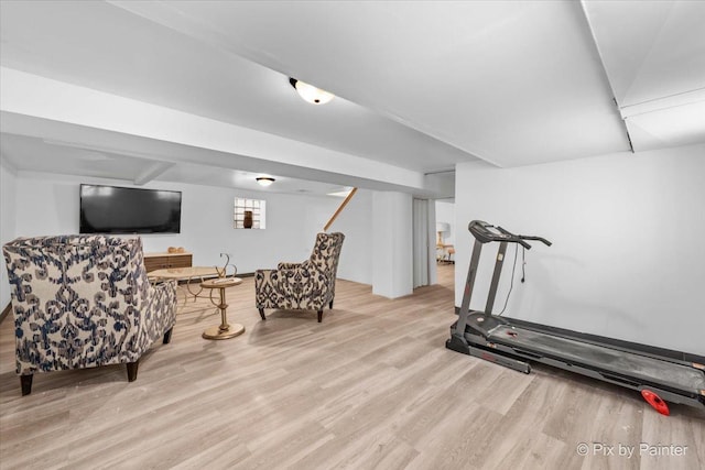 exercise area with light hardwood / wood-style flooring