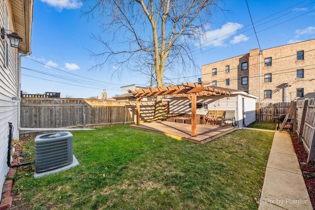 view of yard with a pergola and central AC