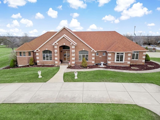 ranch-style home featuring a front lawn