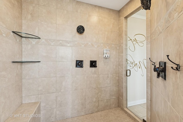 bathroom featuring tiled shower and tile patterned floors