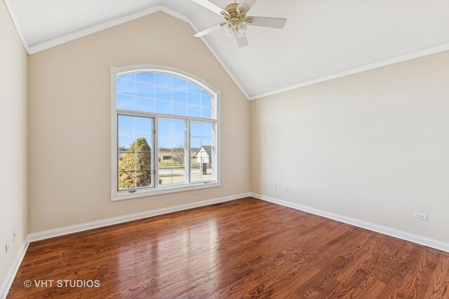 empty room featuring ceiling fan, crown molding, lofted ceiling, and dark wood-type flooring