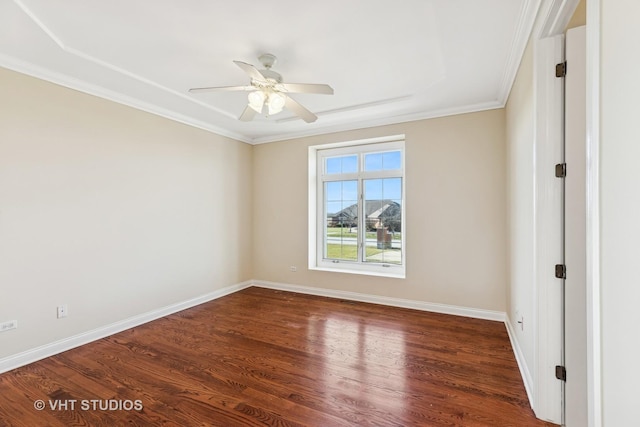 empty room with ceiling fan, crown molding, and dark hardwood / wood-style floors