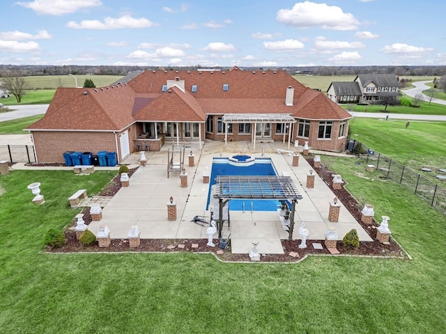 view of pool featuring a lawn and a patio area