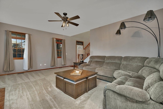 living room featuring ceiling fan and light carpet