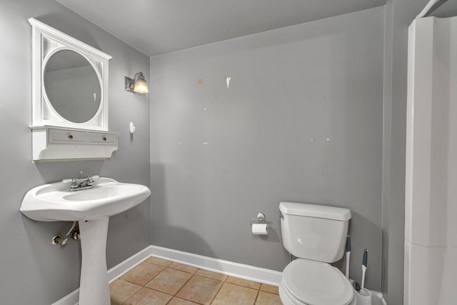 bathroom with tile patterned floors and toilet