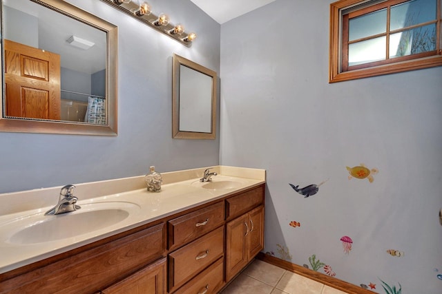 bathroom featuring tile patterned floors and vanity