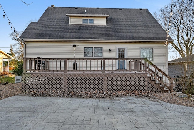 back of property featuring a patio and a deck