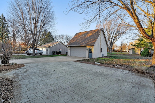 view of property exterior with an outdoor structure