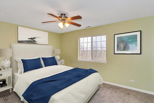 bedroom featuring ceiling fan and light carpet