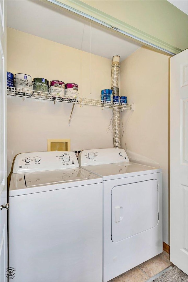 washroom featuring hardwood / wood-style floors and washer and dryer