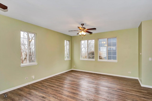 unfurnished room featuring dark hardwood / wood-style floors and ceiling fan