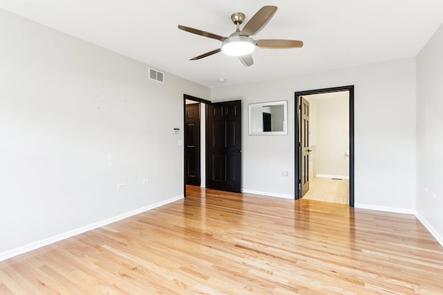 unfurnished room featuring ceiling fan and light hardwood / wood-style floors