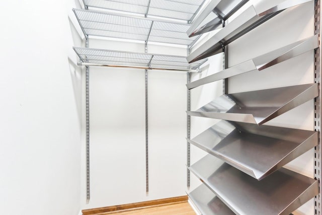 spacious closet featuring light wood-type flooring