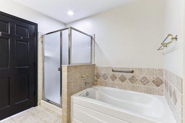 bathroom featuring shower with separate bathtub and tile patterned floors