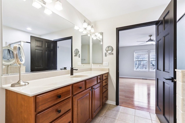 bathroom featuring hardwood / wood-style flooring, ceiling fan, and vanity