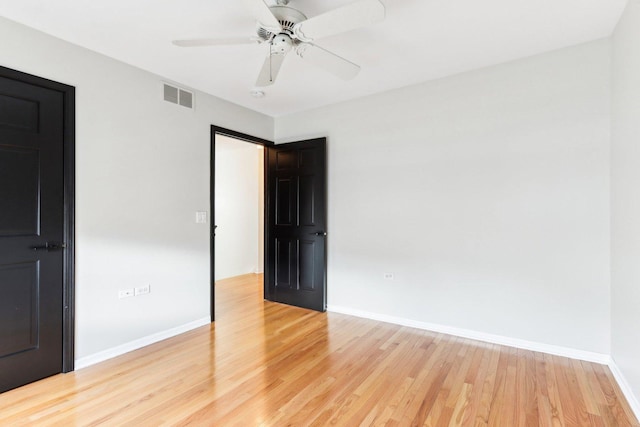 unfurnished room featuring ceiling fan and wood-type flooring