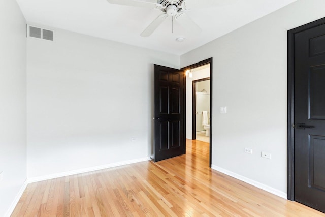 spare room with light hardwood / wood-style floors and ceiling fan