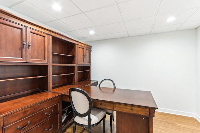 office featuring a drop ceiling and light wood-type flooring