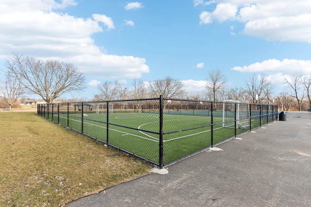 view of home's community with tennis court