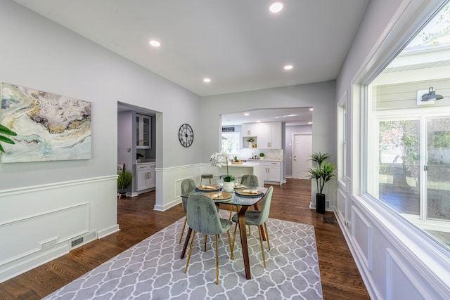 dining area featuring dark hardwood / wood-style floors