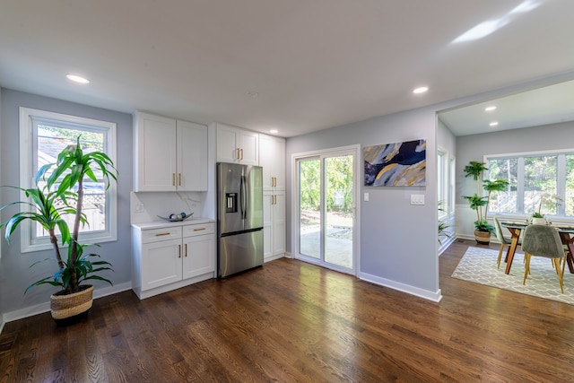 kitchen with white cabinetry, stainless steel fridge with ice dispenser, and dark wood-type flooring