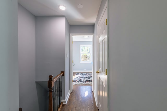 hallway with dark hardwood / wood-style floors