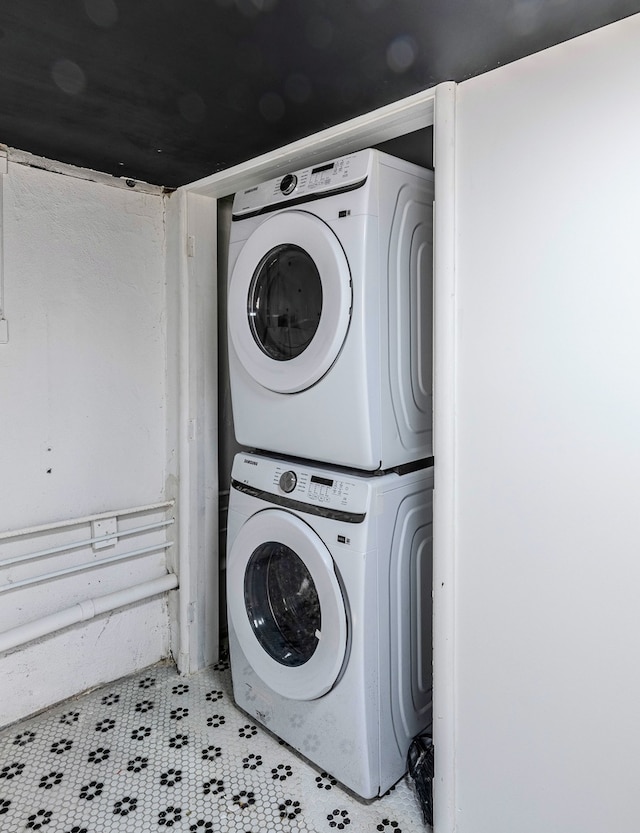 laundry area with stacked washer / dryer