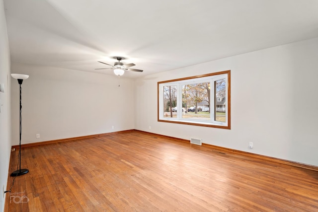 unfurnished room featuring ceiling fan and light wood-type flooring